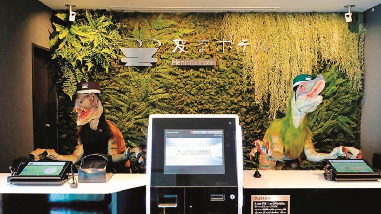 Image of a two robots working at the front desk