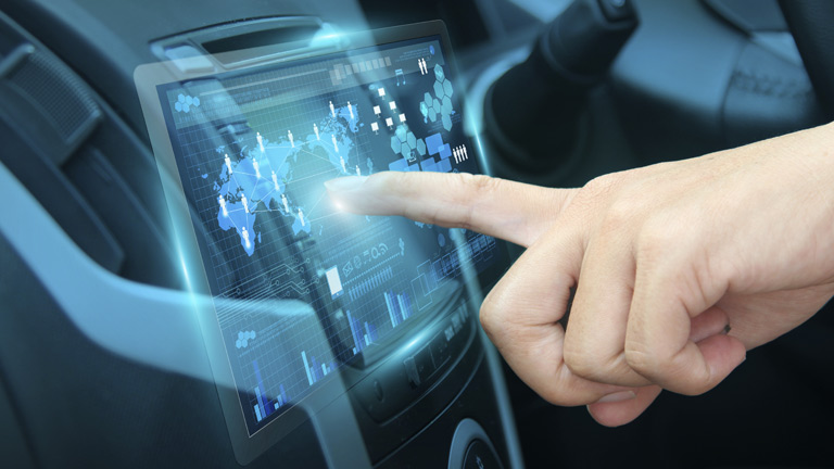 Person using the navigation console in their car