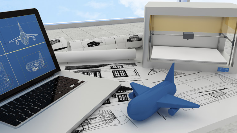 Laptop and 3D printer used to create a blue airplane model